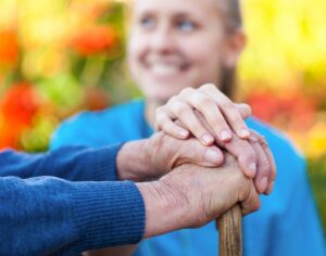 Young woman holding holder woman's hand